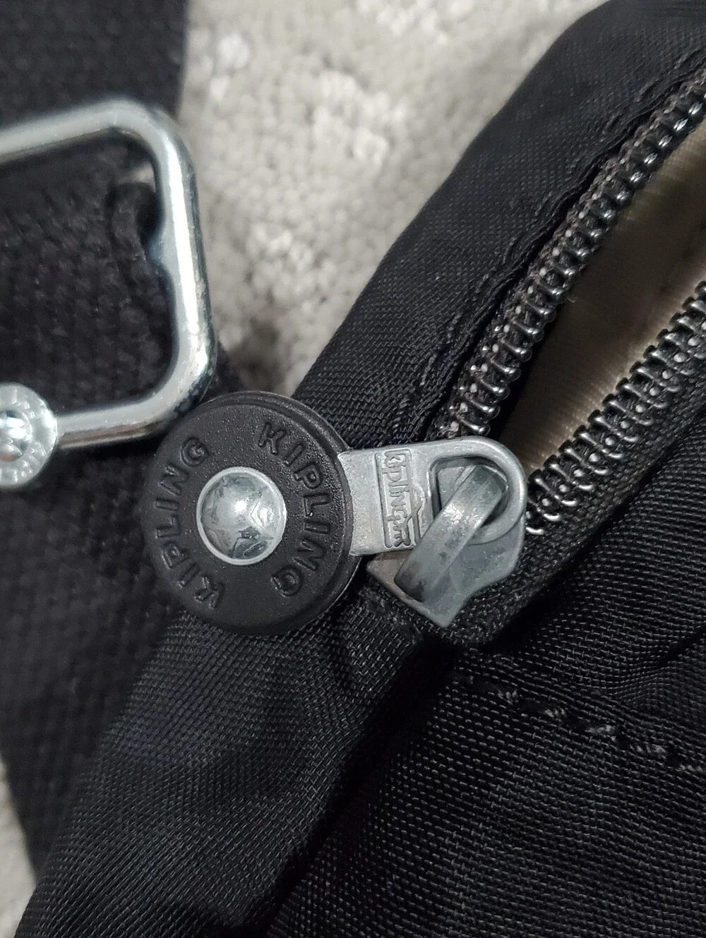 Kipling Queenie Small Backpack Black Nylon Brand Logo on the front flap.